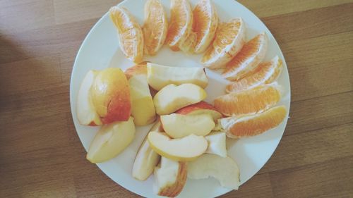 High angle view of fruits in plate on table