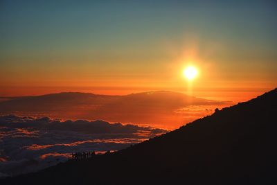 Scenic view of silhouette landscape against romantic sky at sunset