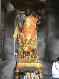 Statue in temple outside building