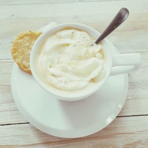 Close-up of cappuccino served on table