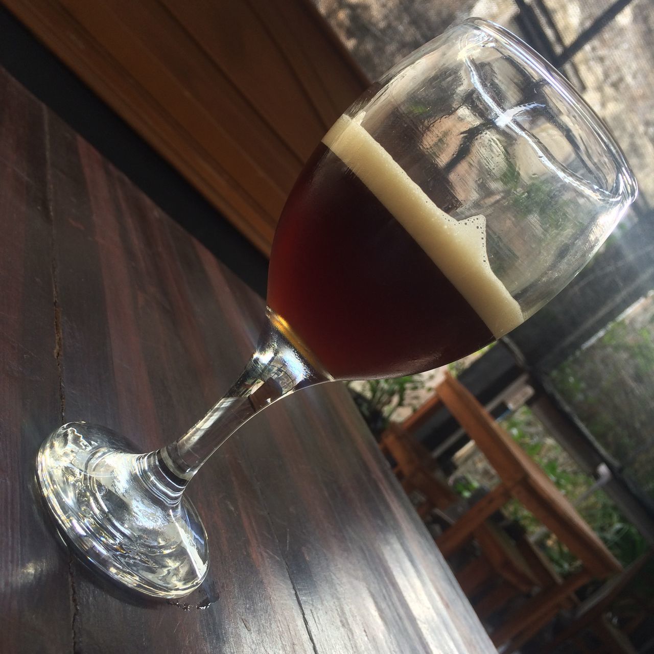 CLOSE-UP OF WINEGLASS ON TABLE WITH GLASS