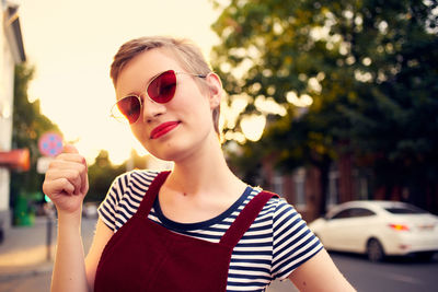 Portrait of young woman in sunglasses