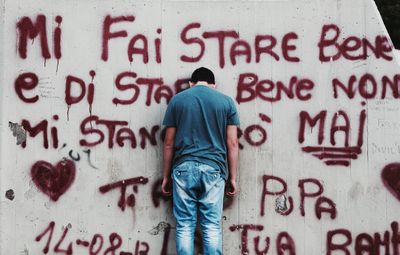 Close-up of woman standing on wall