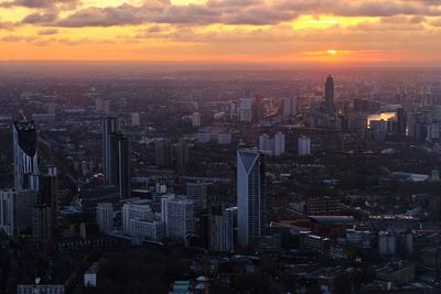 Aerial view of city at sunset