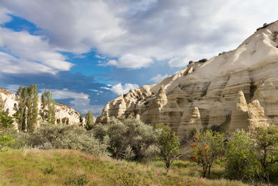 Rocky landscape of white and yellow sandstone in a mountain range between valleys in cappadocia,.