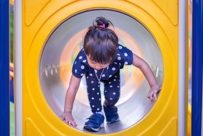 Girl playing in playground