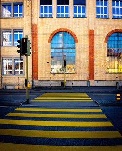 Road by building in city