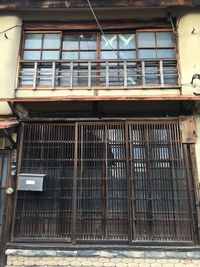 Low angle view of window of old building