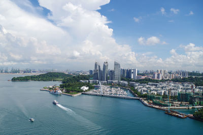 Cityscape against cloudy sky