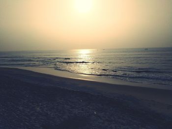 Scenic view of sea against clear sky during sunset