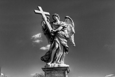 Low angle view of statue against sky