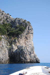 Boat heading into a cave 