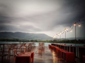 Pier over lake against sky