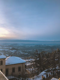 Scenic view of townscape against sky during winter