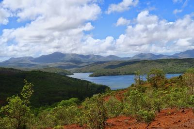 Scenic view of mountains against cloudy sky