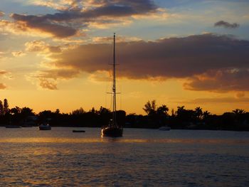 Sailboat on sea at sunset