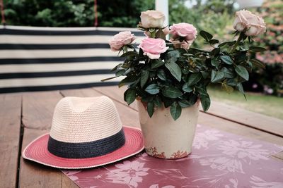 Close-up of pink roses in vase on table