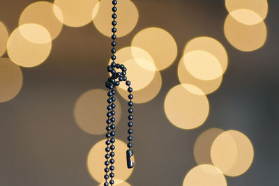 Low angle view of illuminated lighting equipment