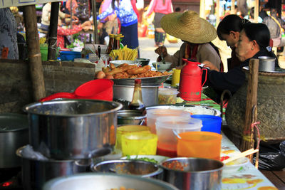 Man preparing food at market stall