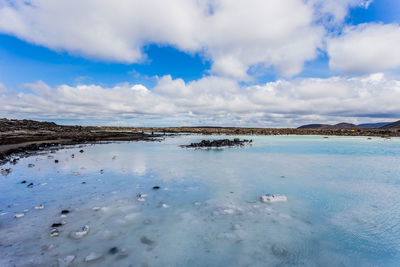 Scenic view of frozen lake against sky