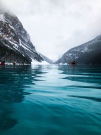Swimming pool in lake against sky
