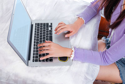 High angle view of woman using laptop