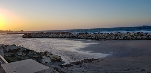 Scenic view of sea against sky during sunset