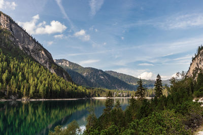 Scenic view of lake and mountains against sky