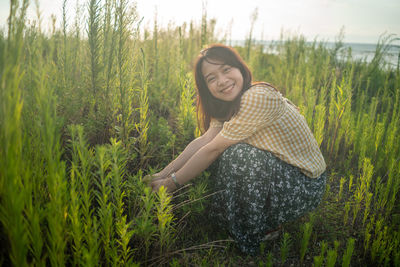 Young woman wearing hat on field