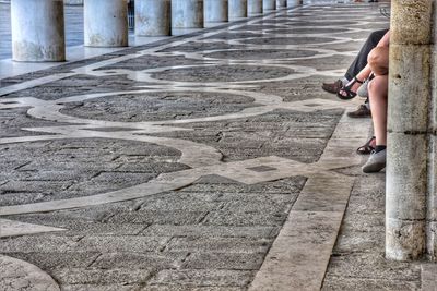 High angle view of man standing on footpath