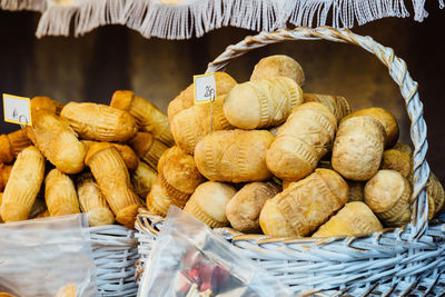 Close-up of breads for sale in wicker basket