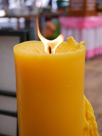 Close-up of yellow drink on table