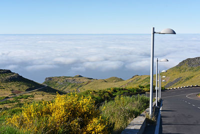 Road by street against sky