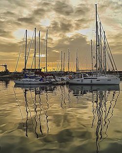 Boats moored at harbor