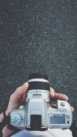 Close-up of hand holding camera