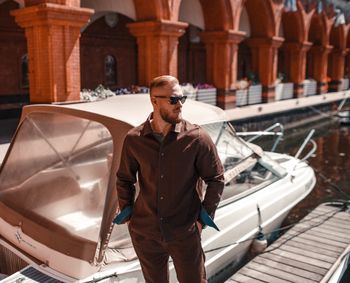 Man wearing sunglasses while standing in city