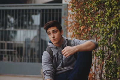 Portrait of young man standing outdoors