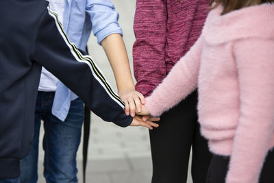 Children with hands together