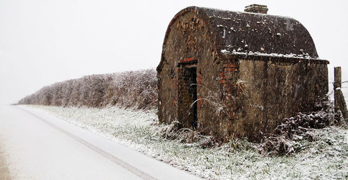 Close-up of stone wall against sky