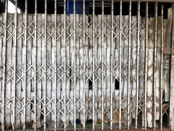 Full frame shot of metal fence against building