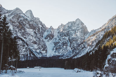 Scenic view of snowcapped mountains against clear sky