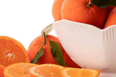 Close-up of orange fruit against white background