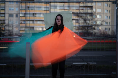 Full length of woman standing in city