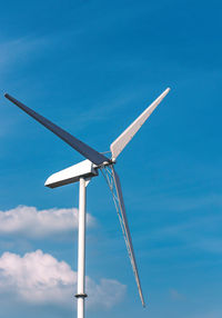 Low angle view of wind turbine against sky