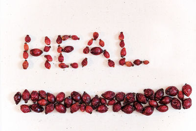 High angle view of berries against white background