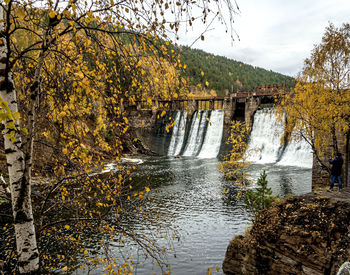 View of the dam on the bolshaya satka river in autumn, the dam is more than 100 years old