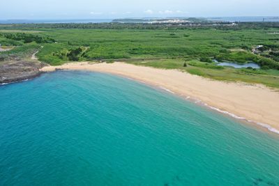 Scenic view of bay against clear sky