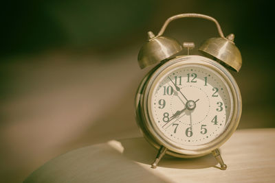 Close-up of clock on table