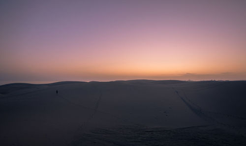 Scenic view of silhouette landscape against sky during sunset