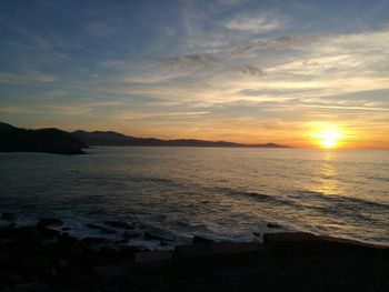 Scenic view of sea against sky during sunset